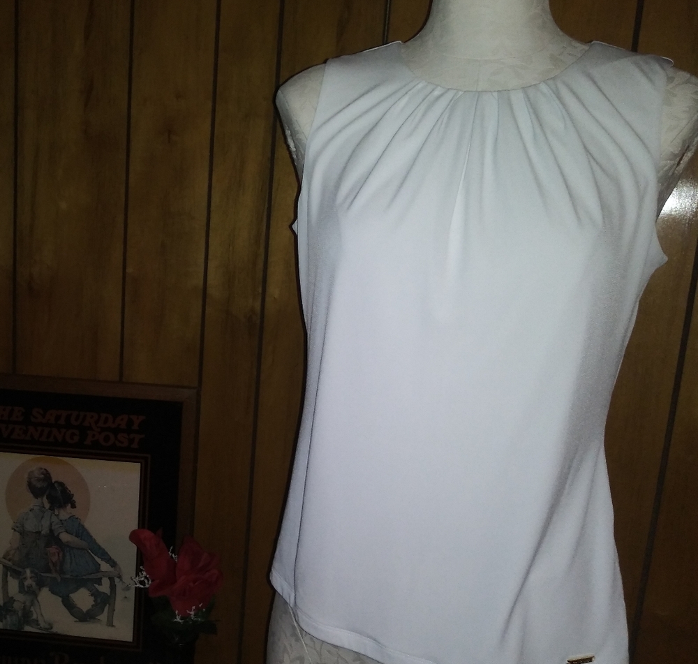 Looks new, classic, white, sleeveless blouse